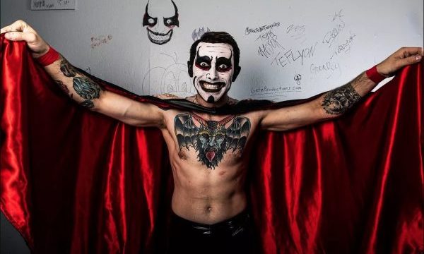A fully formed Danhausen lifts his very nice, very evil cape