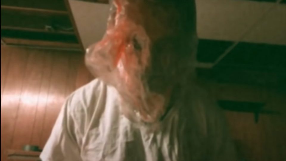 Danhausen with a bag over his head in a shot from his more "disturbing" days.