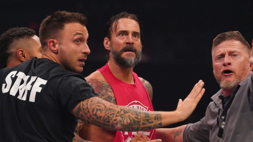 CM Punk held back by security Ace Steel