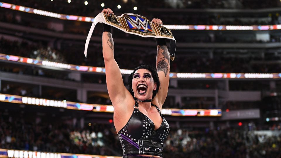 Rhea Ripley celebrates winning the WWE SmackDown Women's Championship at WrestleMania 39