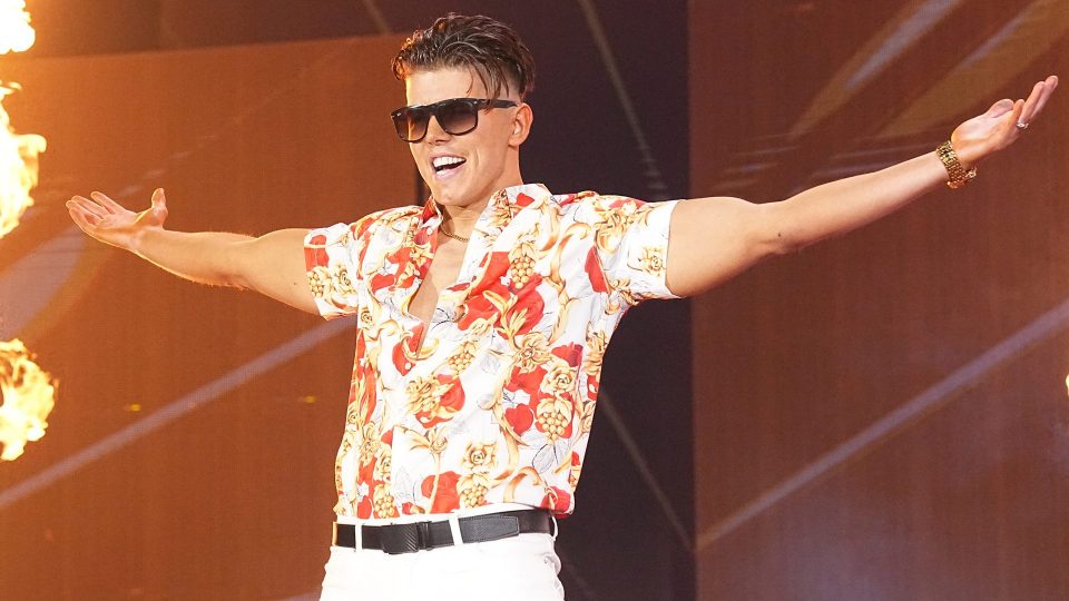 Sammy Guevara making his AEW entrance as part of the Don Callis Family