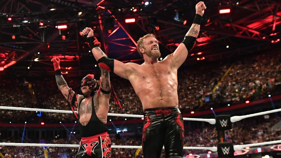 Rey Mysterio and Edge posing at WWE Clash At The Castle