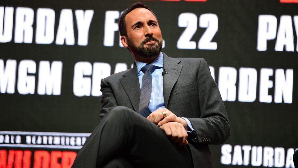 Joe Tessitore sitting during a live panel