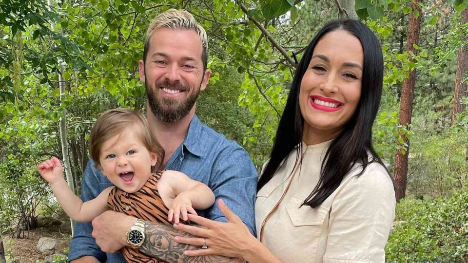 Artem Chigvintsev and Nikki Garcia Nikki Bella with their son Matteo