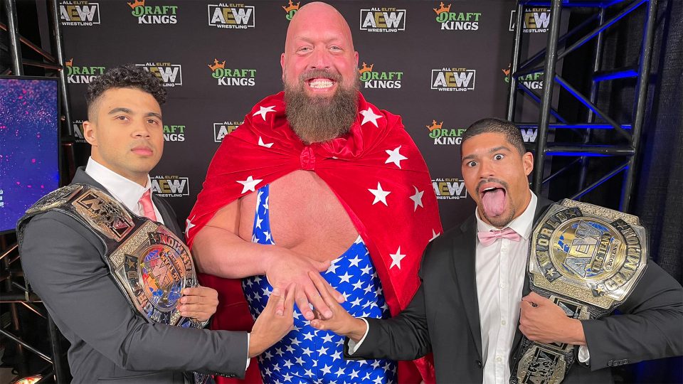 Paul Wight dressed as Captain Insano (middle) posing with Max Caster (left) and Anthony Bowens (right)