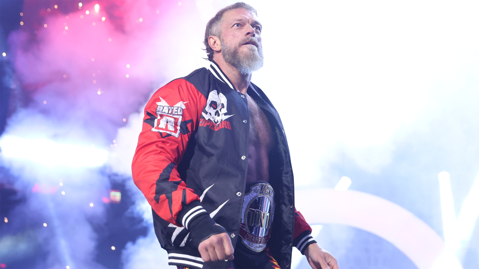 Adam Copeland making his entrance with the TNT Championship in AEW