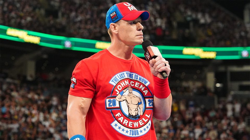John Cena speaking on a microphone looking sombre at WWE Money In The Bank 2025