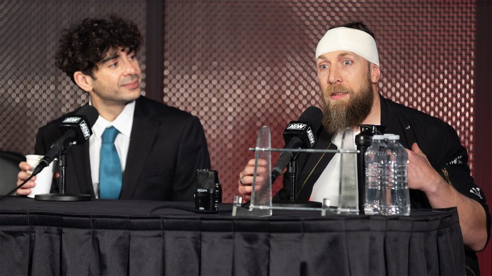 Tony Khan (left) and Bryan Danielson (right) speaking at an AEW media scrum