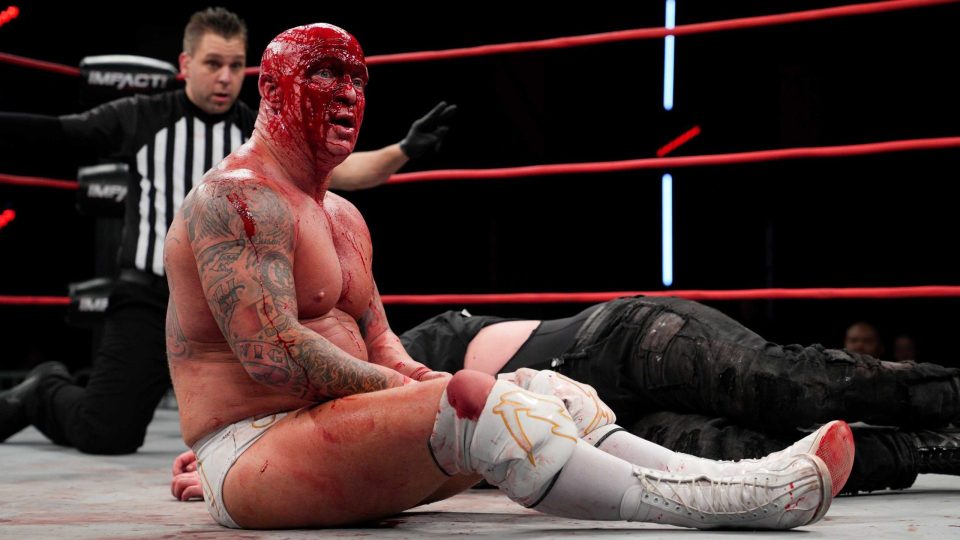 A bloodied Eric Young in the ring during a match on IMPACT (TNA) Wrestling