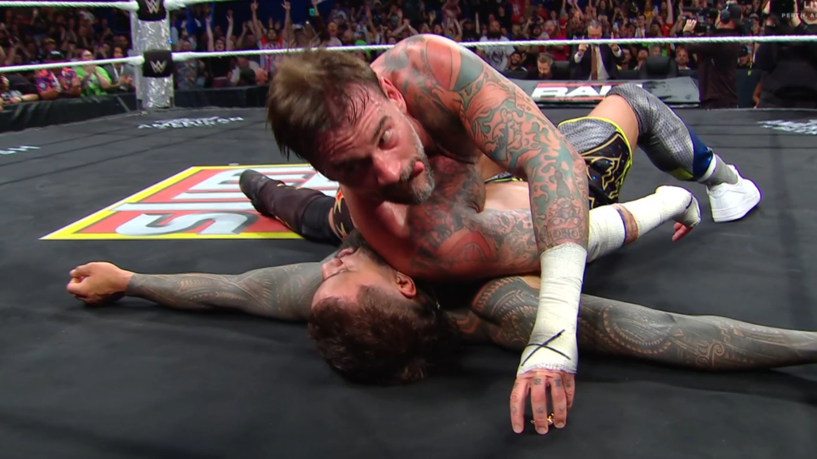 What Did WWE Cameras Catch CM Punk Quickly Grabbing After RAW Win